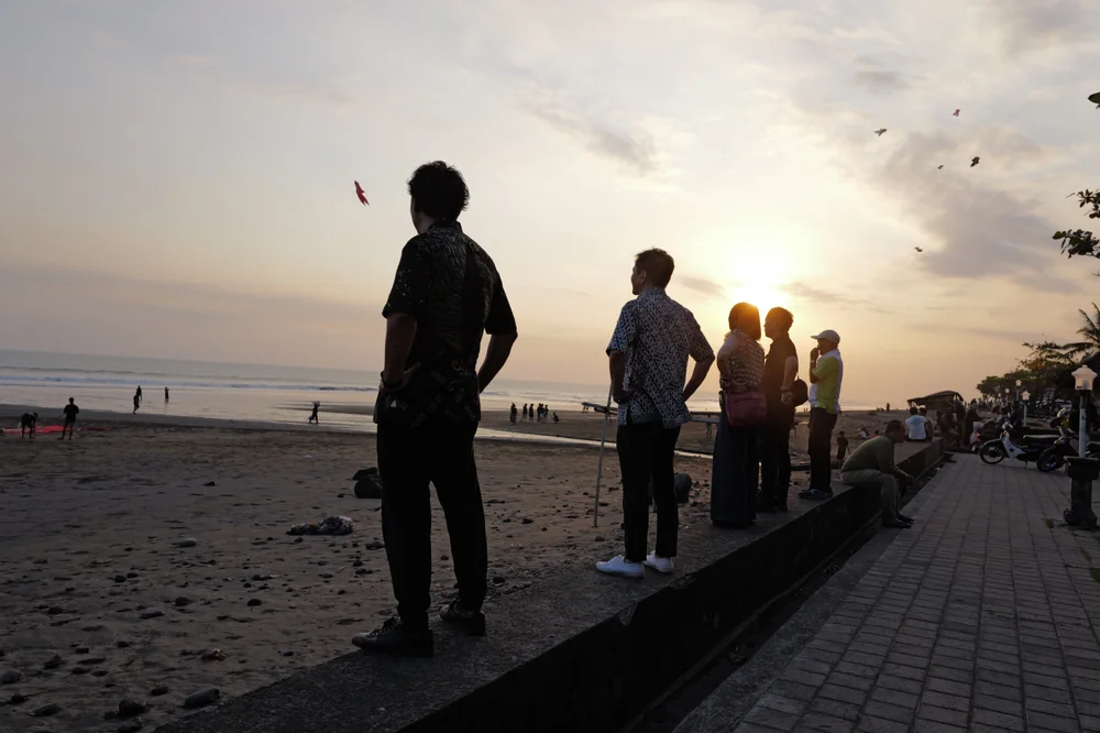 Participants watching the sunset from a beach in Bali