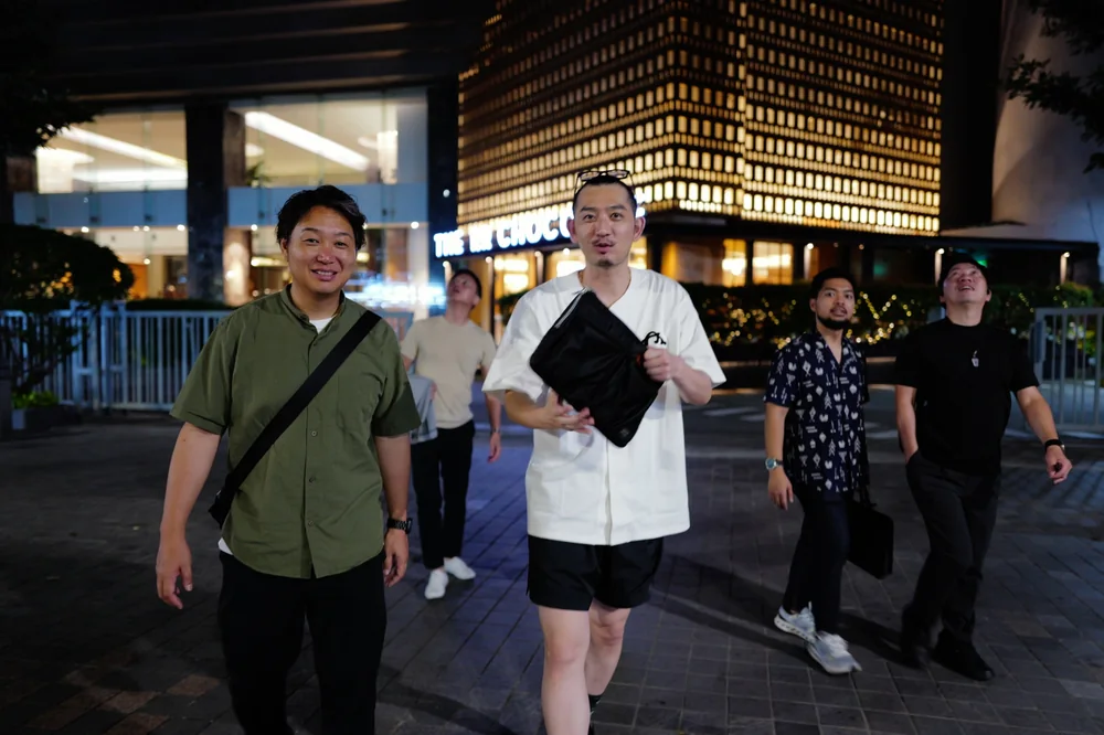 Participants walking together through Jakarta at night