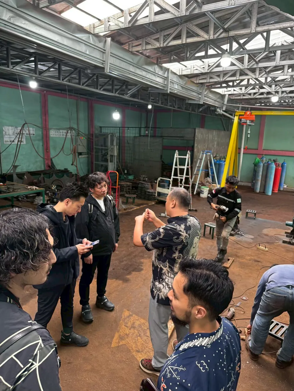 Participants watching a welding training session